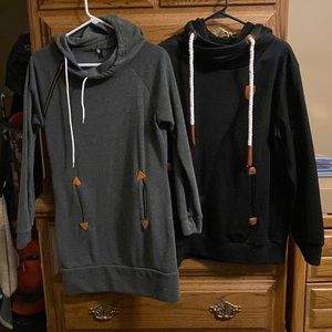 One black and one gray long sleeve sweatshirt.